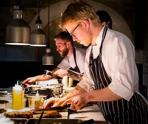 Tom Adam's presenting plates in the kitchen of Coombeshead farm