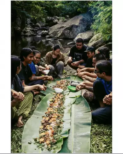 Communal dining on a table of banana leaves Communal dining on a table of banana leaves