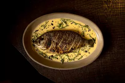 Whole north sea bream with seasonal greens