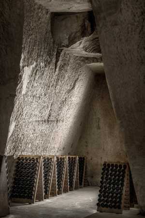 Bottles waiting to be riddled in the historical chalk quarry cellars at Maison Ruinart