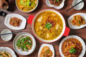 Thin sliced beef with green Sichuan pepper in a golden soup