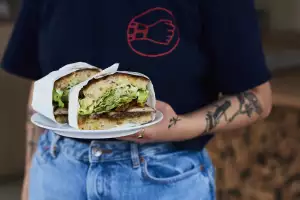 Herb stuffed porchetta, quince aioli, baby gem and watercress salad sandwich