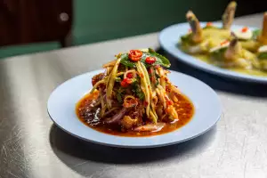 Chicken matches with green mango kerabu