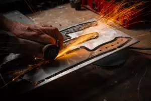 Putting an edge on the steel at the Savernake workshop, in a converted sawmill