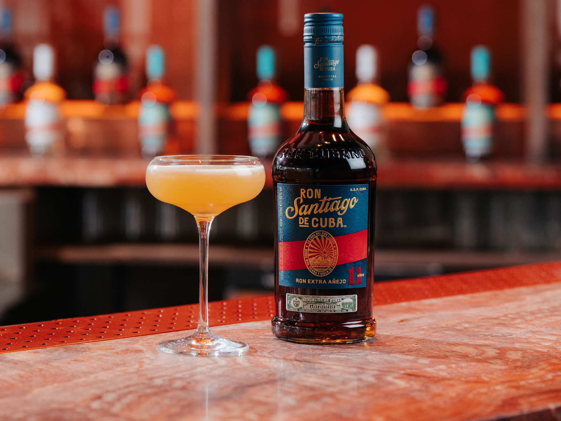 Ron Santiago de Cuba bottle and cocktail