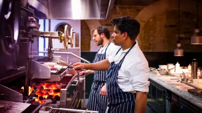 Chefs cooking on the flames at Pitt Cue