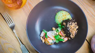 Sticky beef with daikon cucumber som tam, avo and kaffir lime pur&eacute;e, crispy shallots