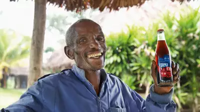 A villager with a bottle of Karma Cola