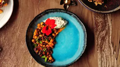 Chickpea salad with rose harissa, smoked hummus, sesame labneh and date syrup