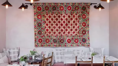 A colourful tapestry on the wall at Bahraini restaurant Villa Mama's