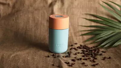 Frank Green's SmartCup in light aqua blue and mid-orange