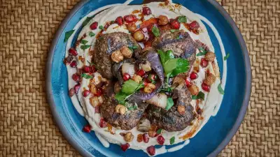 Beef and venison kofte on a bed of hummus and tahini