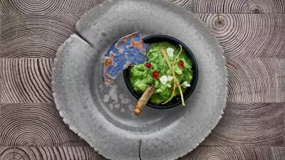 Ella Canta's guacamole with fresh cheese, pomegranate and a gold grasshopper