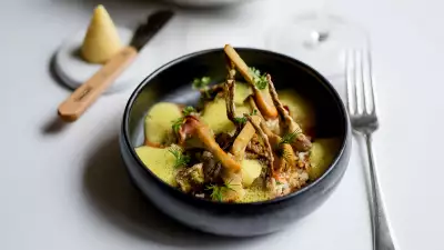 Artichokes '&agrave; la Barigoule', couscous, turmeric emulsion at Roux at the Landau