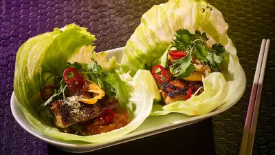 Honey-hoisin grilled pork belly lettuce wraps