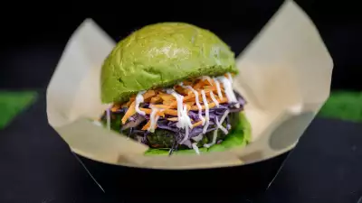 A burger with a green bun