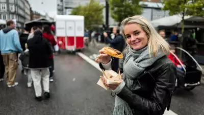 A visitor enjoys a hot dog from the championships