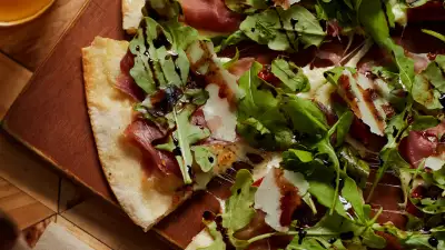 Crate's prosciutto and rocket pizza