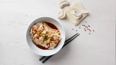 Pork and prawn wontons with noodles in Sichuan sauce