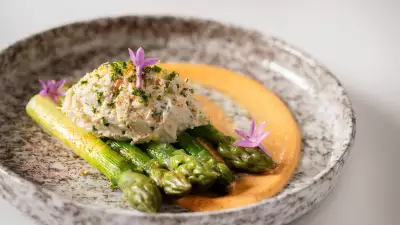 Crab and gold rush apple salad, green asparagus and mimosa dressing