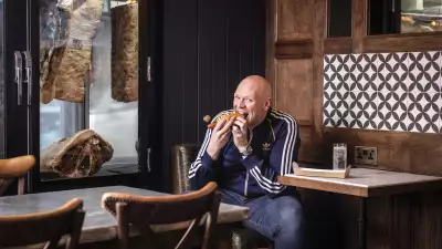 Tom Kerridge enjoying a hotdog at The Butcher's Tap & Grill