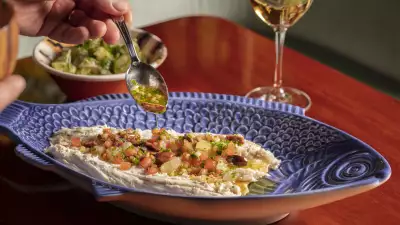 Whole sea bass baked in a salt crust with sauce vierge