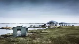 A traditional Icelandic smokehouse beside Lake Myvatn