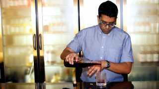 White Lyan's Ryan Chetiyawardana pouring a cocktail in his bar