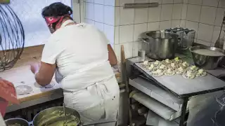 Preparing Karelian pasties in a bakery, Helsinki, Finland, Autumn 2013, from Magnus Nilsson's Nordic: A Photographic Essay of Landscapes, Food and People