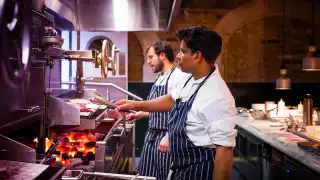 Chefs cooking on the flames at Pitt Cue