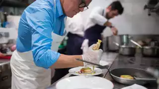 Alain Passard prepares a dish at L'Arpège