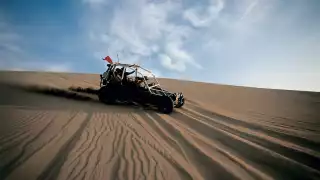 Sandboarding in the dunes around the Huacachina oasis