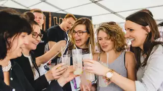 A group of friends enjoying the expertly mixed drinks