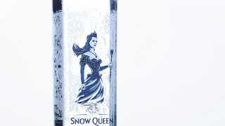 Bottle of Snow Queen vodka with its wintery blue logo on a white background
