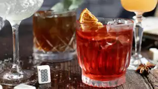 Barrel-aged plum wine negroni made from campari, gin, plum wine and chocolate bitters