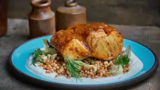 Cod smothered in chermoula with artichokes and Israeli cous cous