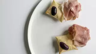 San Daniele Prosciutto, 'grissini' and Kalamata olive from Roux at the Landau