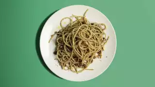 Spaghetti with anchovy, pine nuts, sultanas and wild fennel