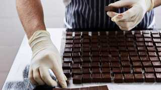 One of the Rococo team making fresh chocolates