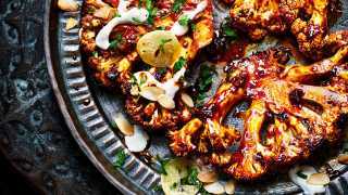 Charred cauliflower with tahini and lemon slices