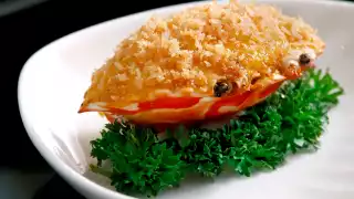 Baked crab meat, cheese and onions on crab shell