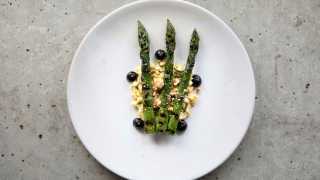 Grilled asparagus with black garlic and egg