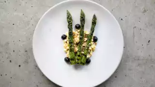 Grilled asparagus with black garlic and egg