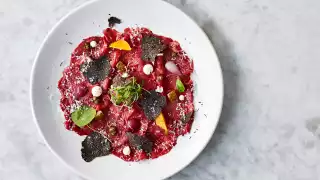 Red Hereford beef carpaccio with black truffle, grana padano and pickles