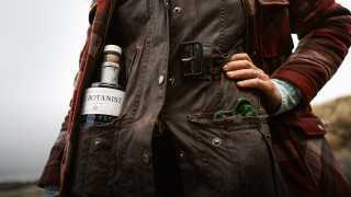A forager with a bottle of The Botanist Gin