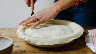 Cutting a pastry off a pie