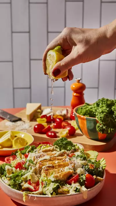 Lemon drizzled over a Neat salad