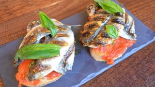 Ember Yard's grilled sardines on toast with tomato and fresh basil Ember Yard's grilled sardines on toast with tomato and fresh basil