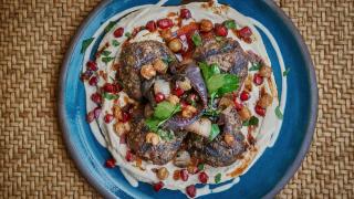 Beef and venison kofte on a bed of hummus and tahini