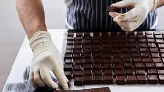 One of the Rococo team making fresh chocolates